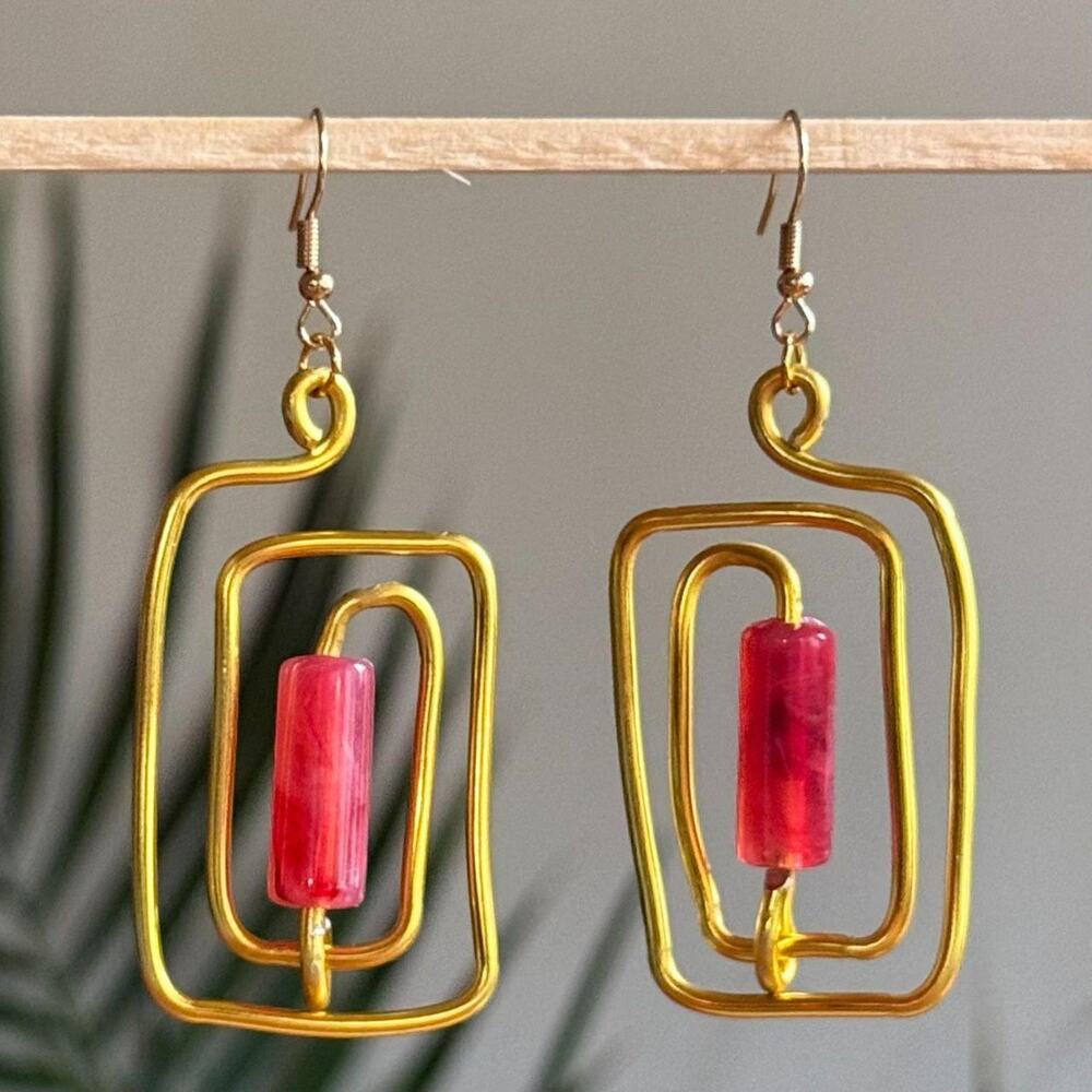 handmade gold wire spiral earrings with hot pink colored tube beads